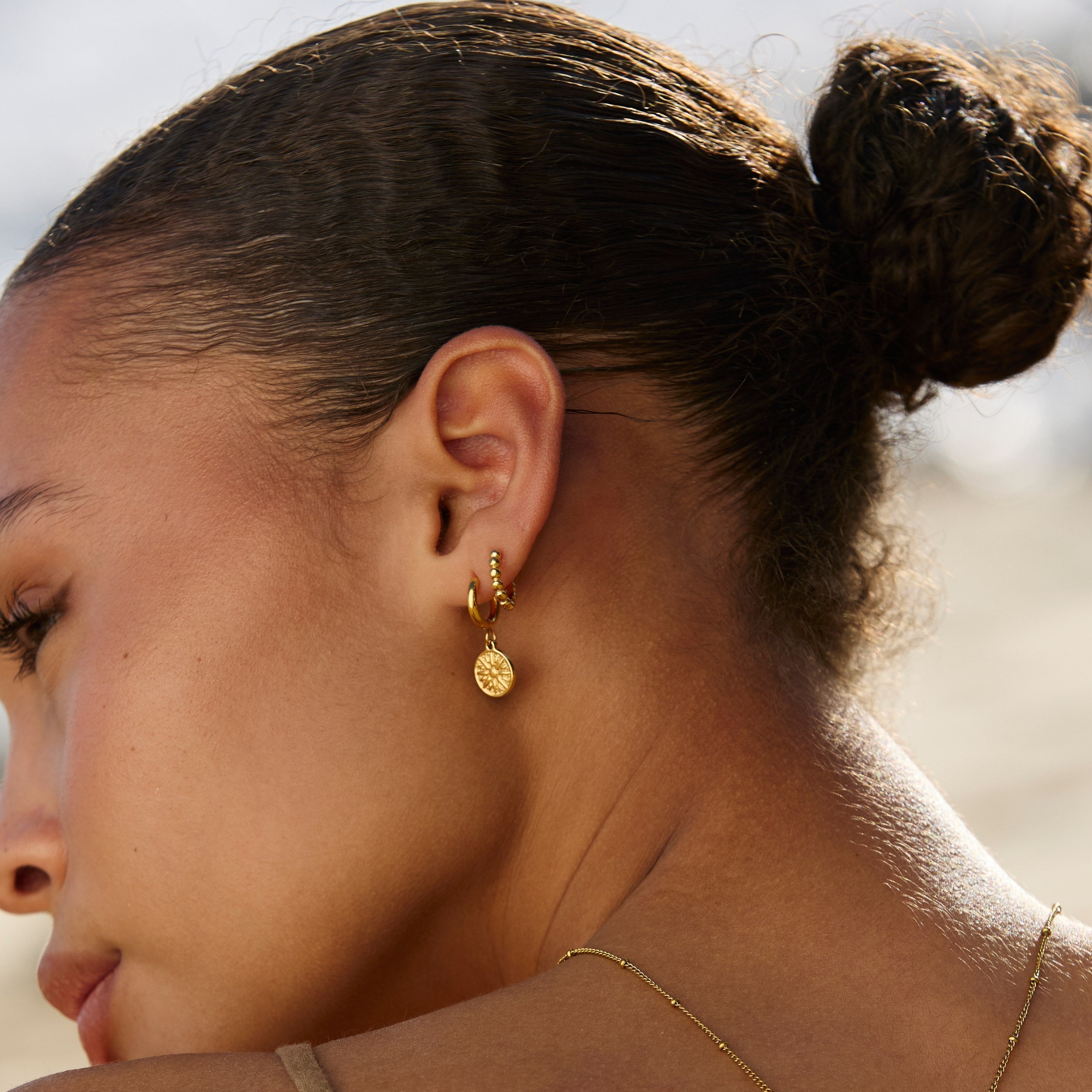 Boucles d'oreilles solaires dorées