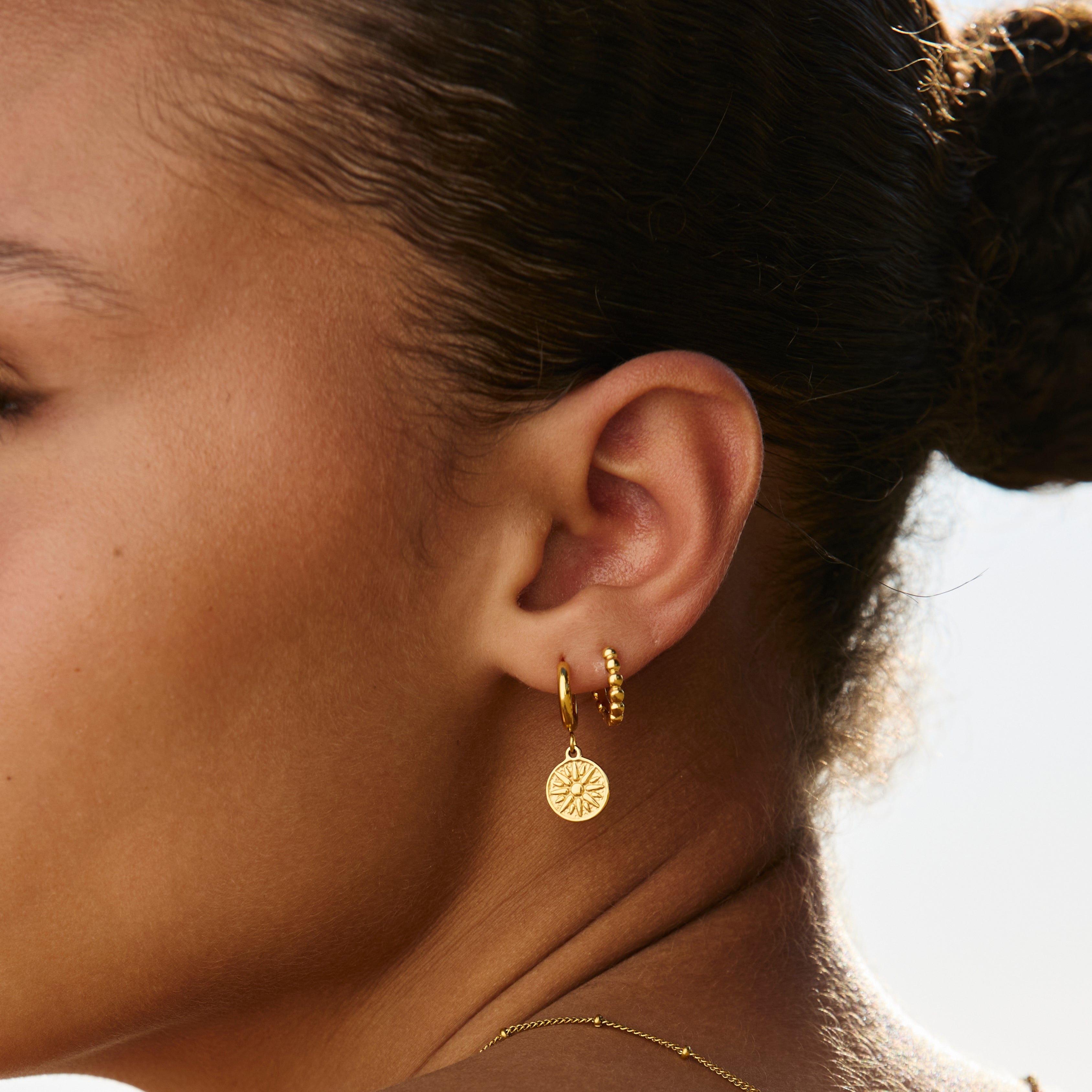 Boucles d'oreilles solaires dorées